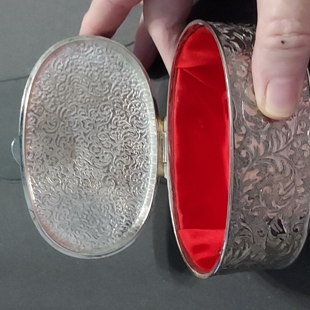 Embossed Silverplated Oval Trinket Case.Silver/Red 4.5inLx1 3/4in.H.x2.5in.W.